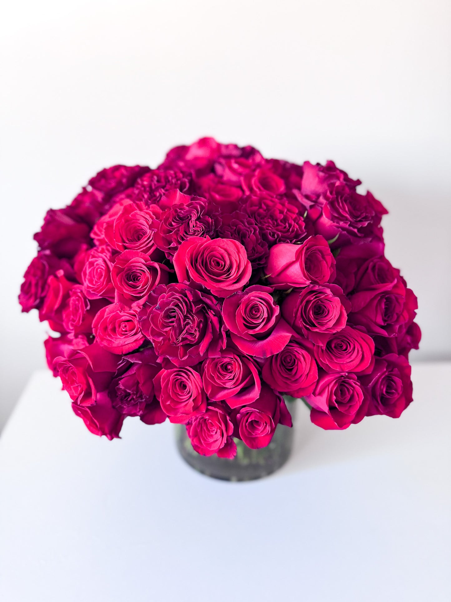The ultimate luxury gift of romance, 100 stems of premium red roses in an elegant vase for anniversary, birthday, engagement, or just because. Order for delivery in Edina, Minneapolis, South Minneapolis, Eden Prairie, Bloomington, Wayzata and Richfield