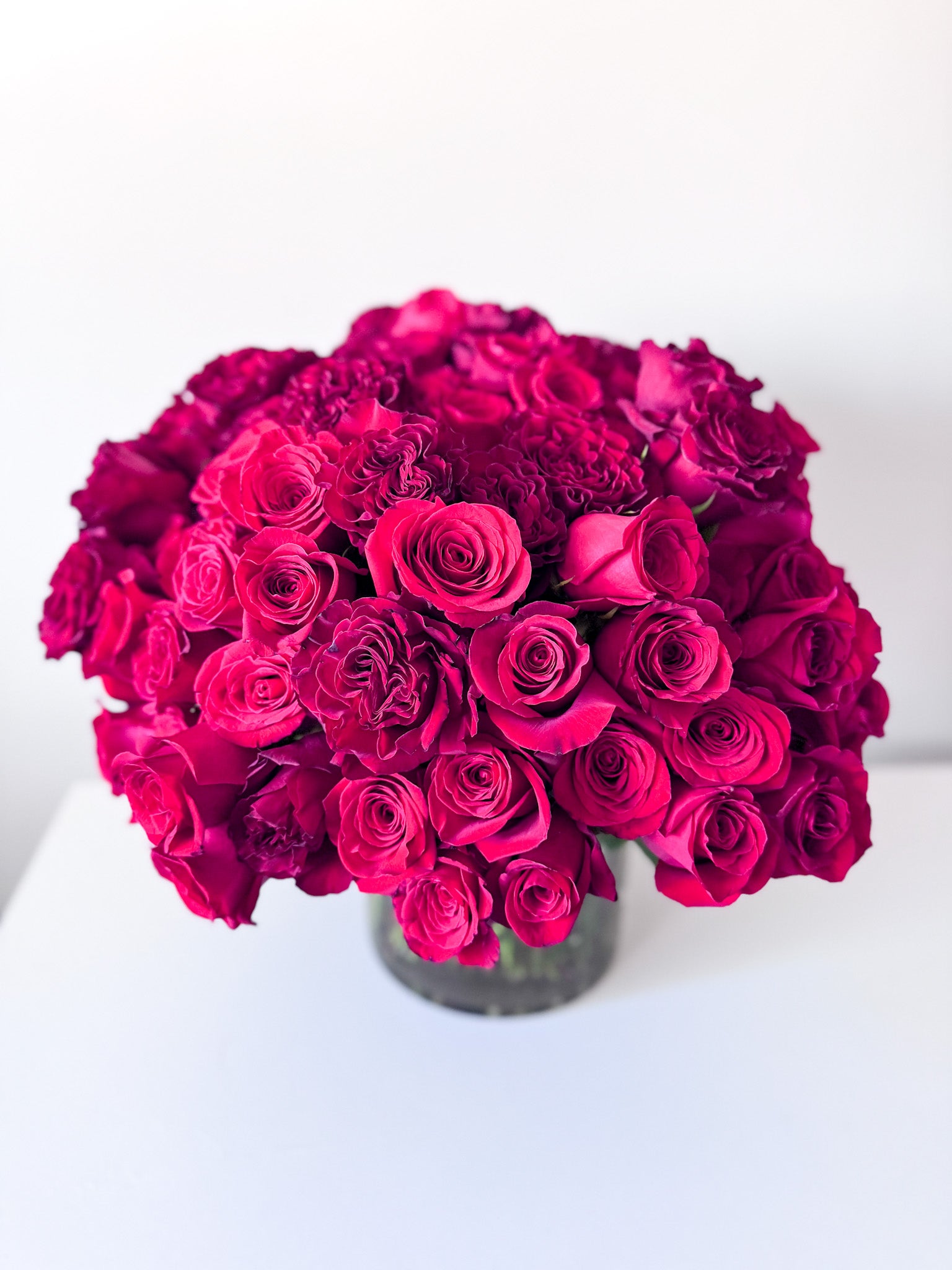 The ultimate luxury gift of romance, 100 stems of premium red roses in an elegant vase for anniversary, birthday, engagement, or just because. Order for delivery in Edina, Minneapolis, South Minneapolis, Eden Prairie, Bloomington, Wayzata and Richfield