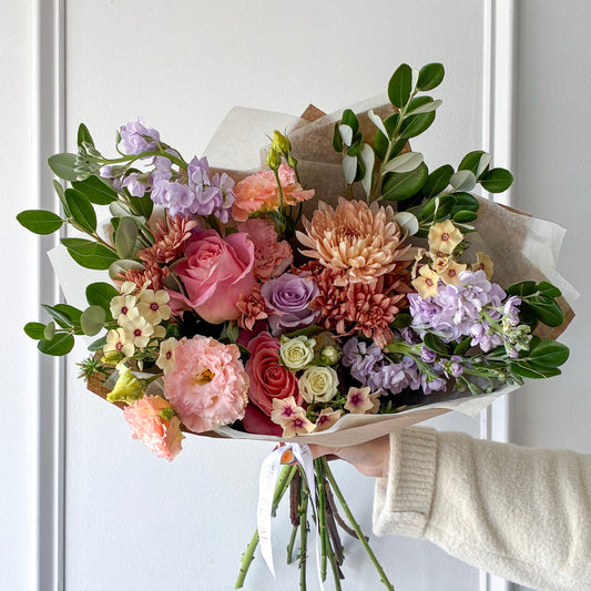 Soft colorful summer flowers wrapped in a hand-tied bouquet for pickup or delivery in Edina, Minneapolis, Minnetonka, St. Louis Park and Bloomington.