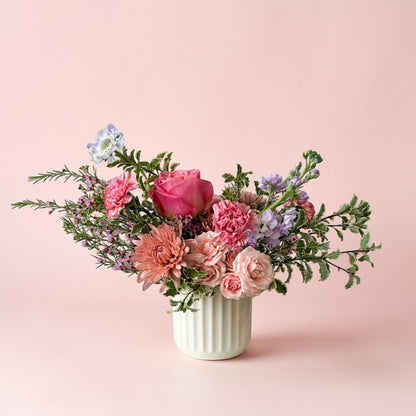 Unique spring floral arrangement in ceramic vase for Mother's Day with roses. perfect gift for delivery in twin cities. Sustainable flower shop. Same day delivery.