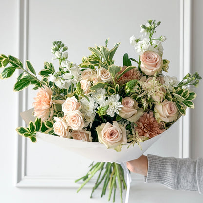 Bouquet of white, blush pink and peach flowers artfully designed for the perfect gift. Order from your trusted, flower shop, The Petal for pickup or delivery in Minneapolis, Edina, Bloomington, or Wayzata.