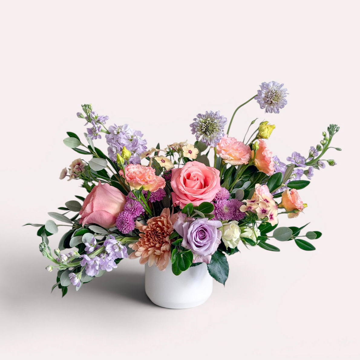 Vase arrangement of colorful summer flowers in a ceramic vase for delivery in Edina, Wayzata, Minnetonka, and Minneapolis. 