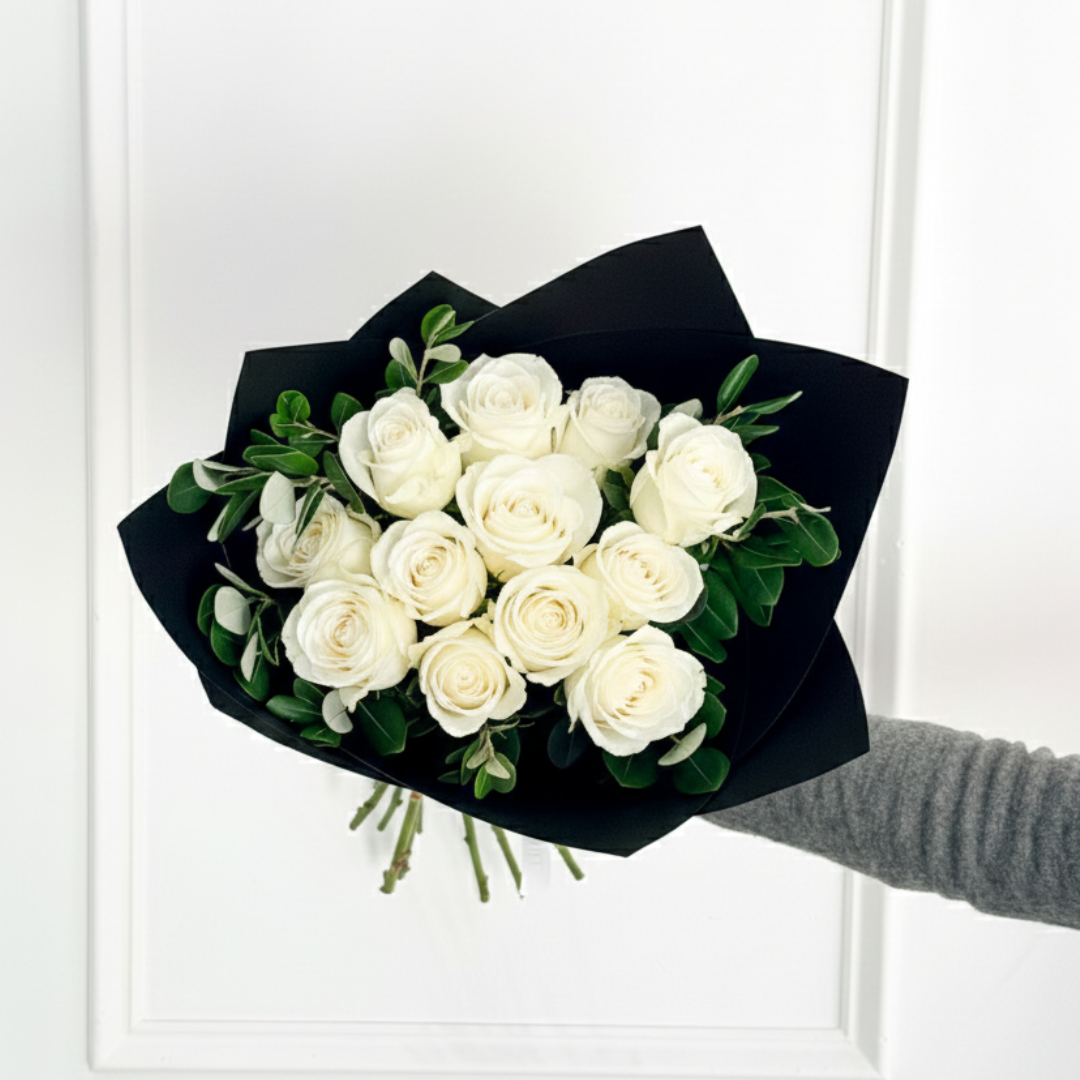 Show your love this Valentine’s Day with a hand-tied white rose bouquet featuring fresh greenery, elegantly wrapped in premium wrap, available for local delivery to Hopkins, Minnetonka, and Excelsior.