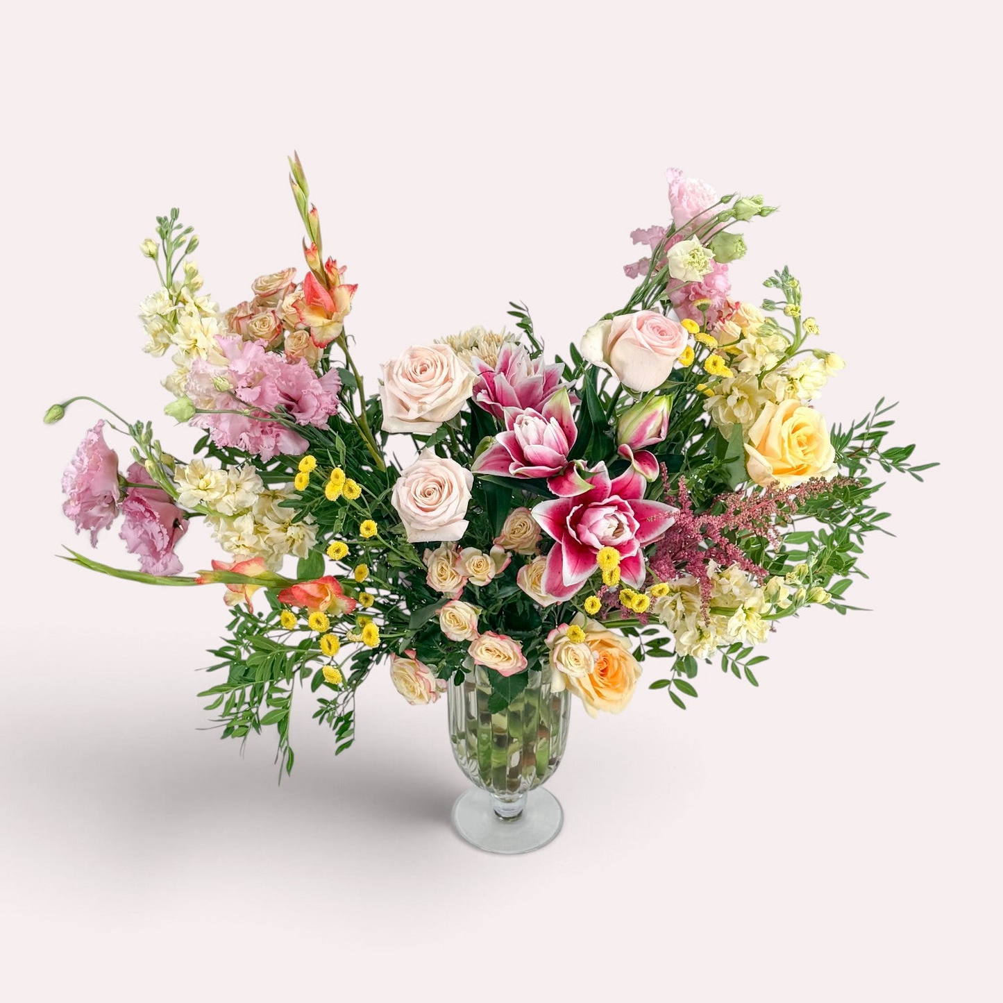 Luxury floral arrangement featuring pink, yellow, peach, and white flowers, available for delivery in Edina, Minneapolis, Minnetonka and Bloomington.