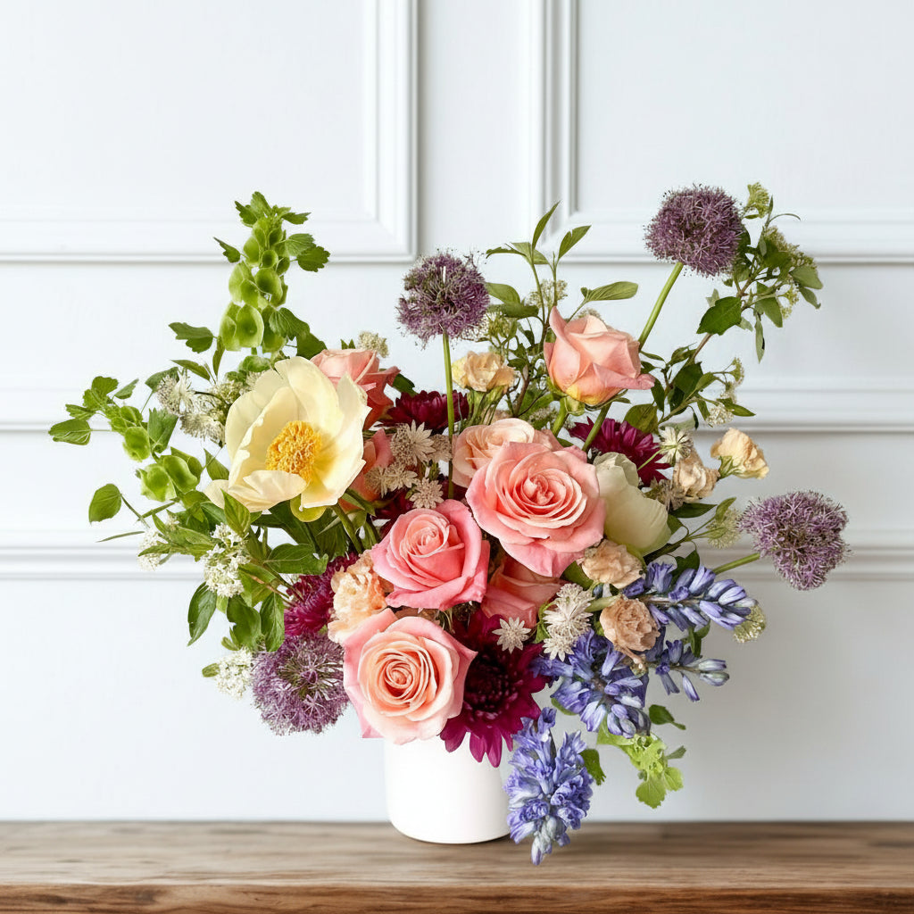Premium sympathy floral arrangement with vibrant seasonal blooms in a keepsake ceramic vase, refined garden-style design delivered to Edina, Golden Valley, and Excelsior