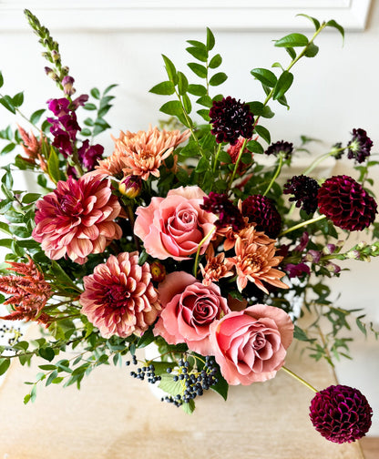Garden-inspired Deluxe floral arrangement featuring seasonal blooms in ceramic vase, Minneapolis delivery