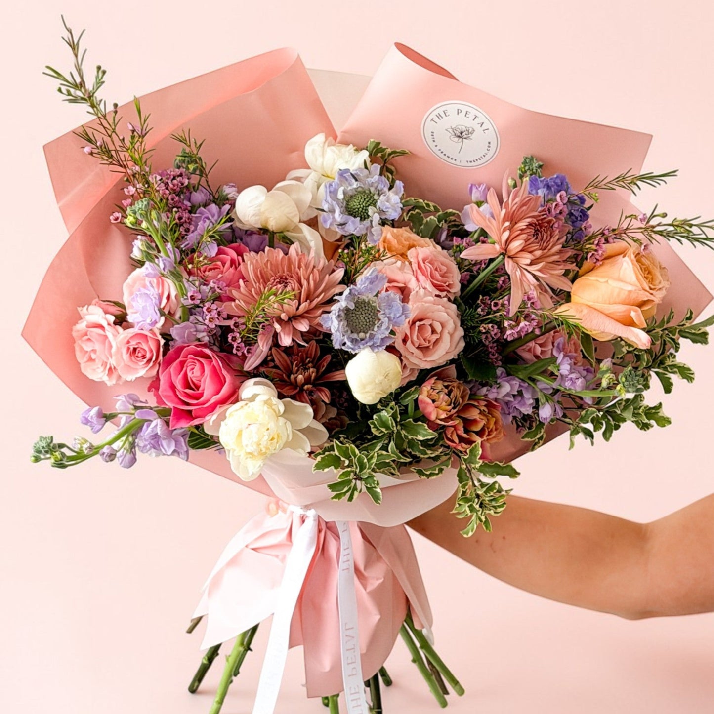 Luxury flowers for Mother's Day with peonies, roses, ranucnulus, and tulips hand-wrapped with premium paper in Edina, Wayzata, Excelsior, Plymouth, Minneapolis