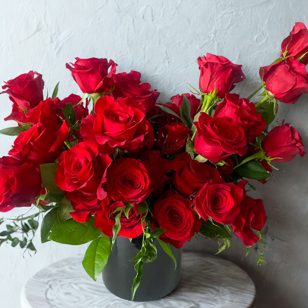 Tall vase rose arrangement with fresh red roses, available for local delivery in Edina, Bloomington, and Eden Prairie.