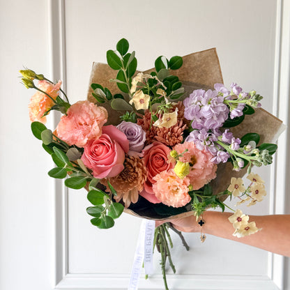 Bouquet of colorful summer flowers wrapped in premium paper for birthday, anniversary, new baby or just because. Order for pickup or delivery in Minneapolis, Shakopee, Savage, and Prior Lake.