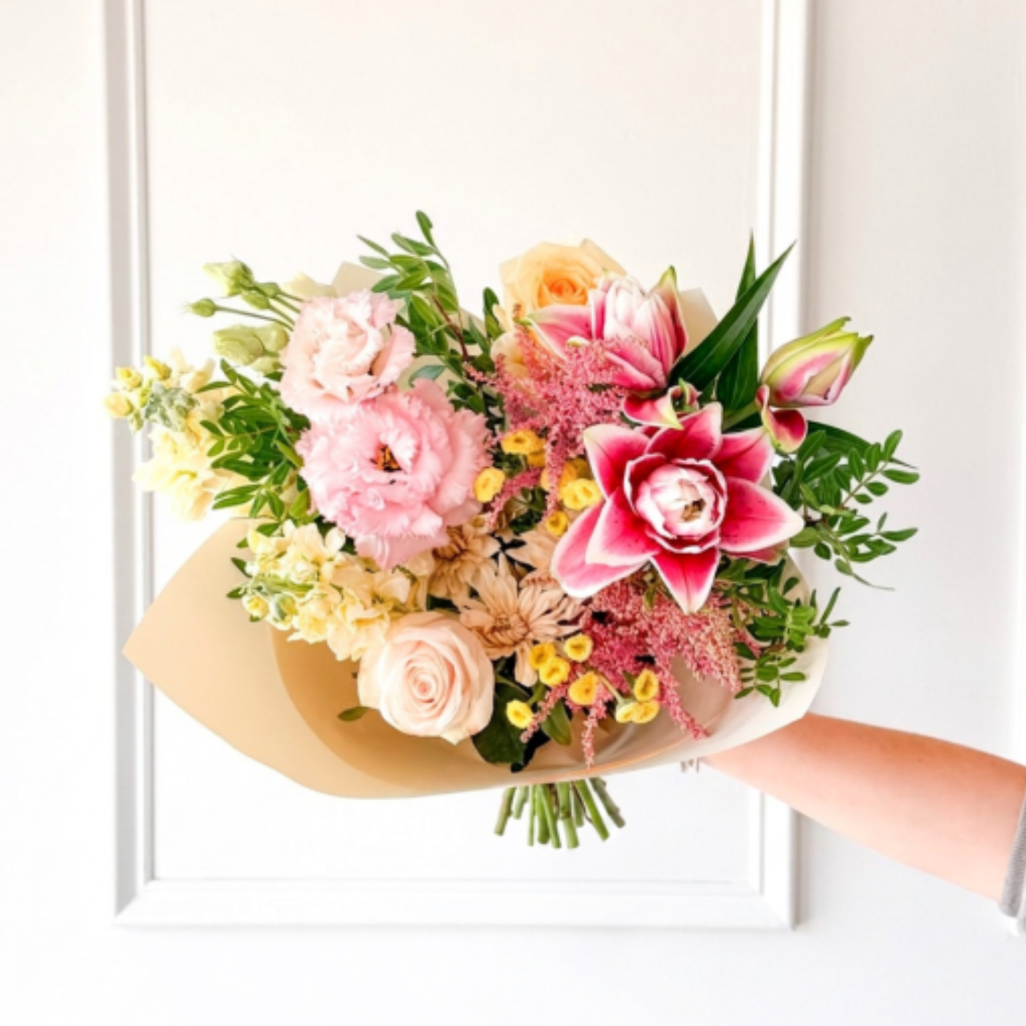 A luxury bouquet of summer flowers hand-tied in premium paper from a local flower shop in Edina for delivery in Minneapolis.