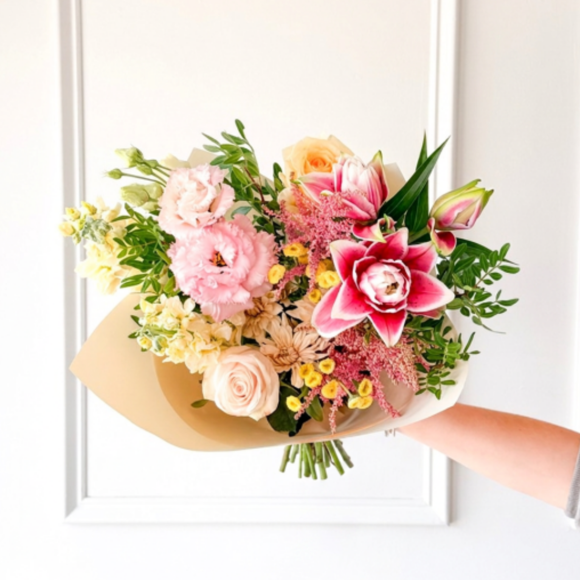 A luxury bouquet of summer flowers hand-tied in premium paper from a local flower shop in Edina for delivery in Minneapolis.