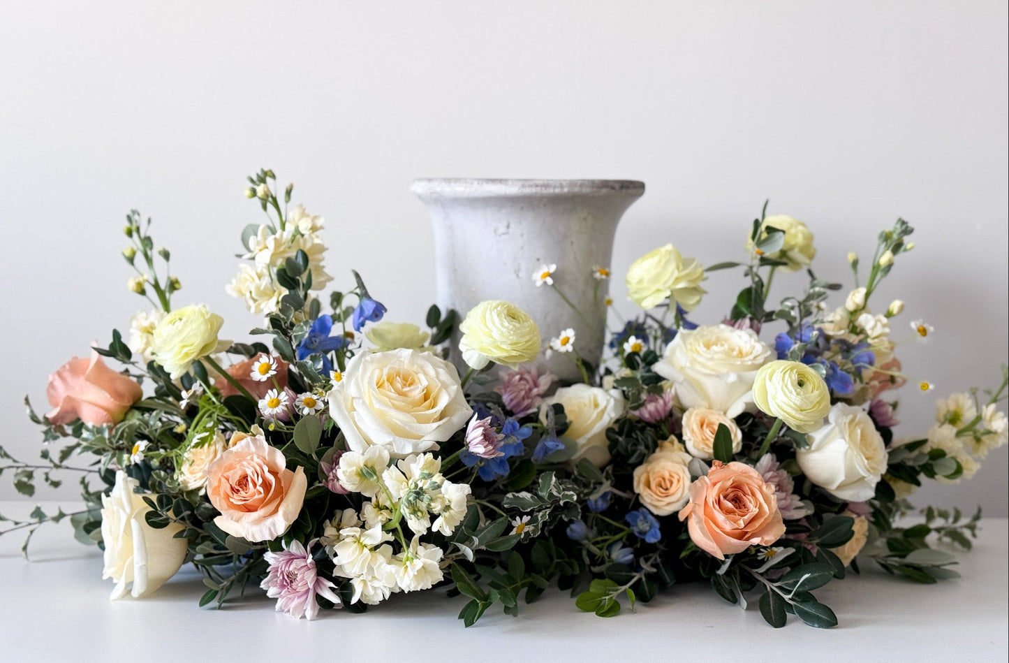 Luxury Classic urn surround with natural seasonal blooms, elegant funeral flowers arrangement, pick-up in Edina or delivery to Richfield, Hopkins, and Golden Valley