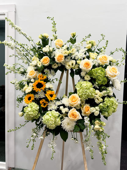 Signature wreath on stand with seasonal blossoms and garden-inspired arrangement, bespoke floral design, available for pick-up in Edina or delivery to Edina, Southwest Minneapolis, and Minnetonka