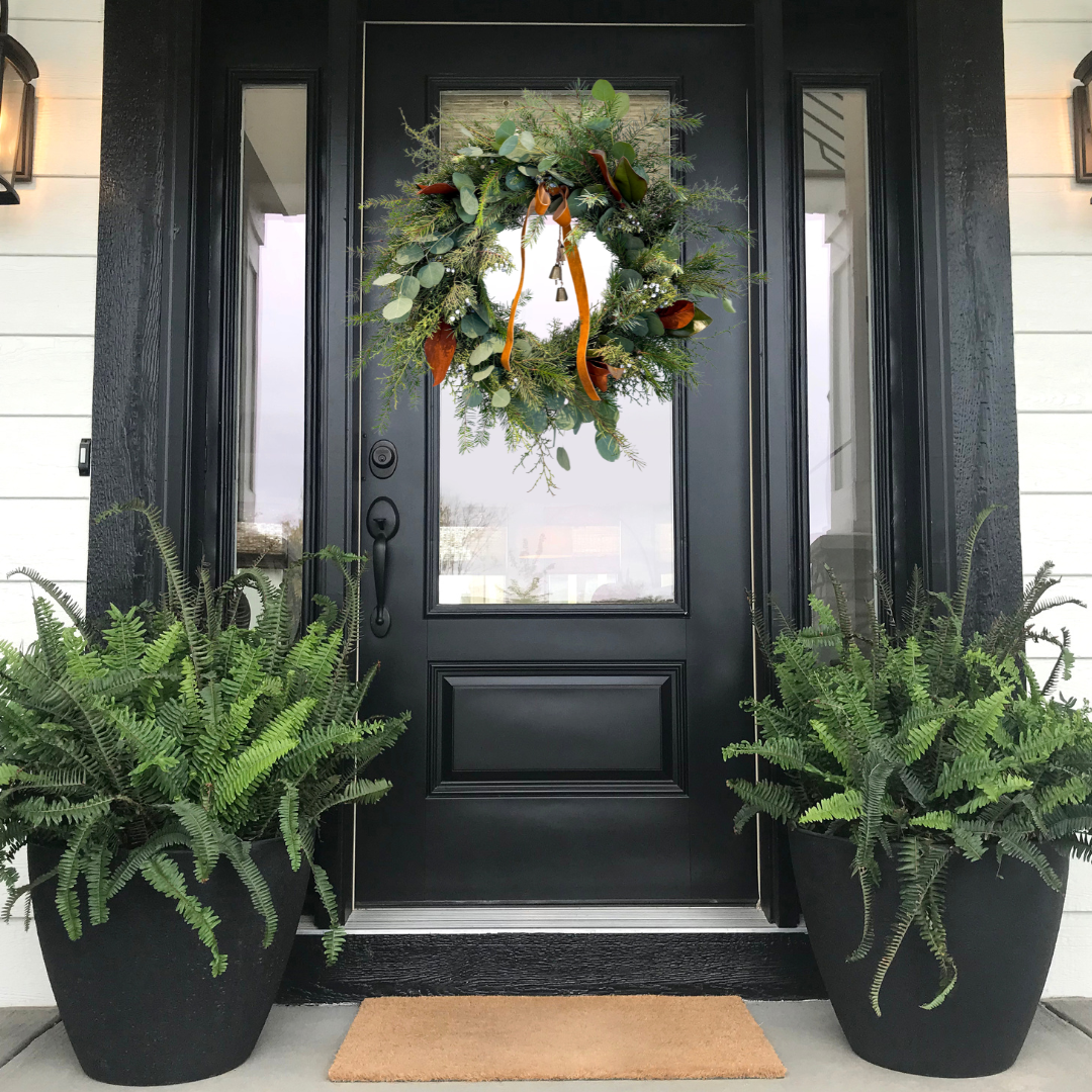 Festive holiday wreath featuring lush evergreen branches, seasonal accents, pinecones, and ribbons, perfect for front door décor or seasonal gifting, available for Edina pick-up or Minneapolis delivery