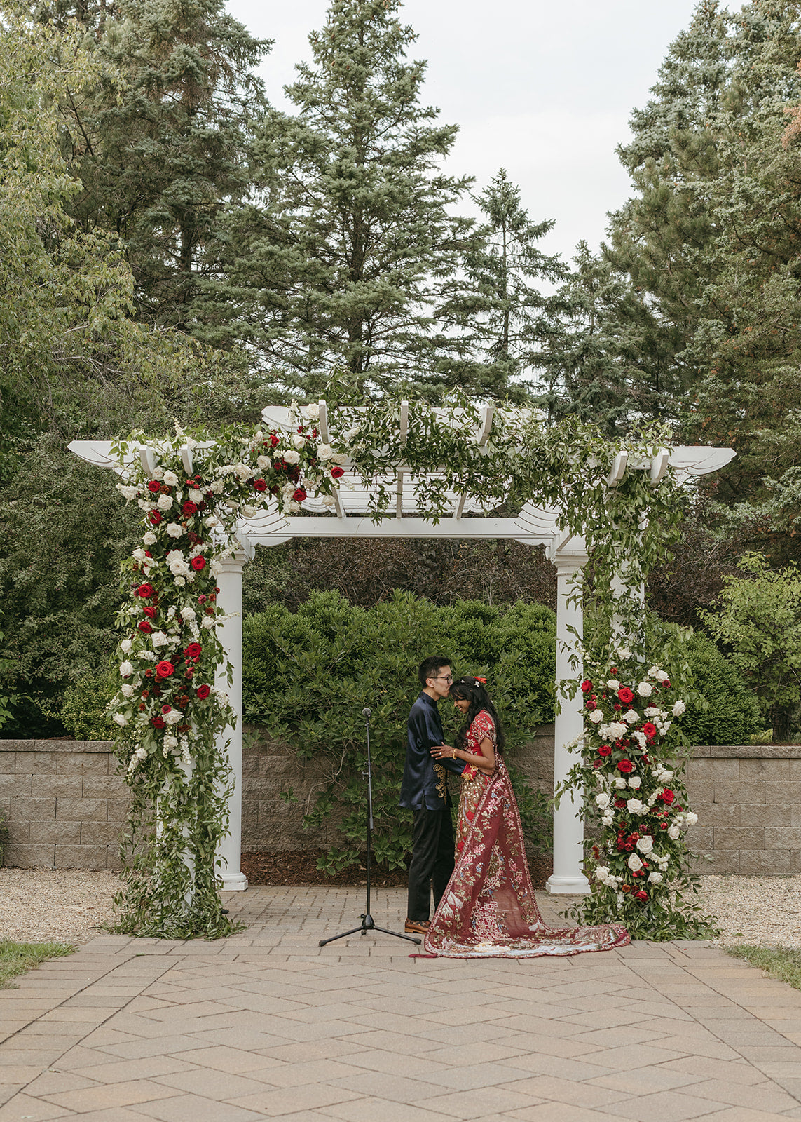 Large scale floral arch installation for a southeast asian wedding at gardens of castle rock by The Petal Floral Design