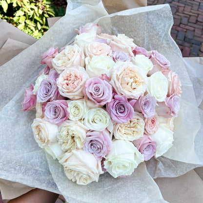 Luxury hand-tied bouquet of 50 premium mixed roses, sophisticated and vibrant floral arrangement, ideal for gifting or home decor, available for pick-up in Edina or delivery to Uptown Minneapolis, South Minneapolis, and Golden Valley