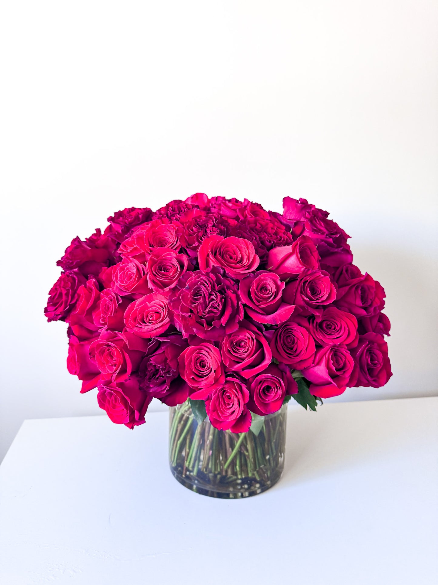 Premium pink roses arranged in an elegant vase, sophisticated luxury floral arrangement, ideal for special occasions or gifting, pick-up in Edina or delivery to Downtown Minneapolis, Eden Prairie, and Richfield