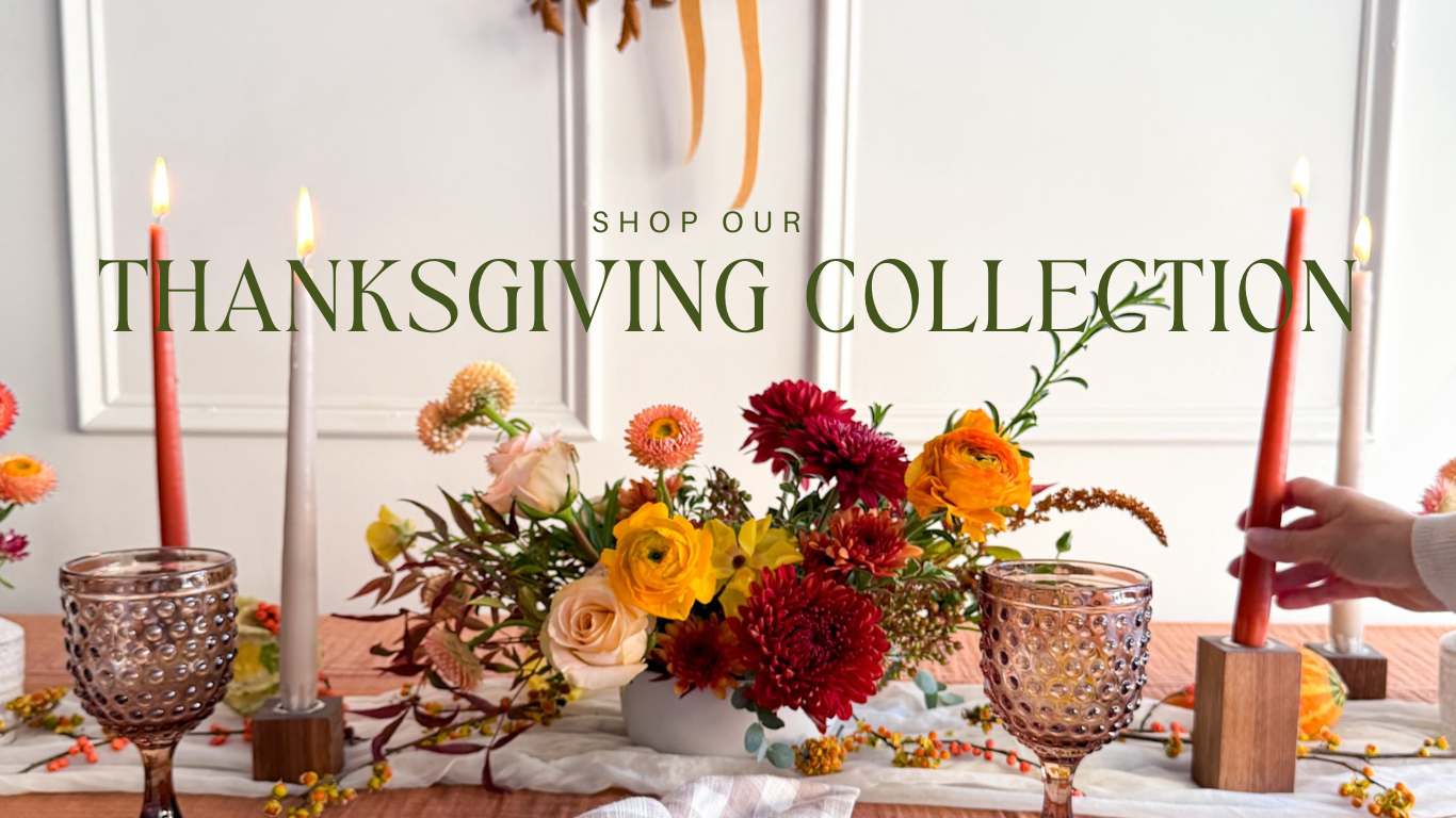 Thanksgiving centerpiece with flowers, candles, and text 'Shop our Thanksgiving Collection'.