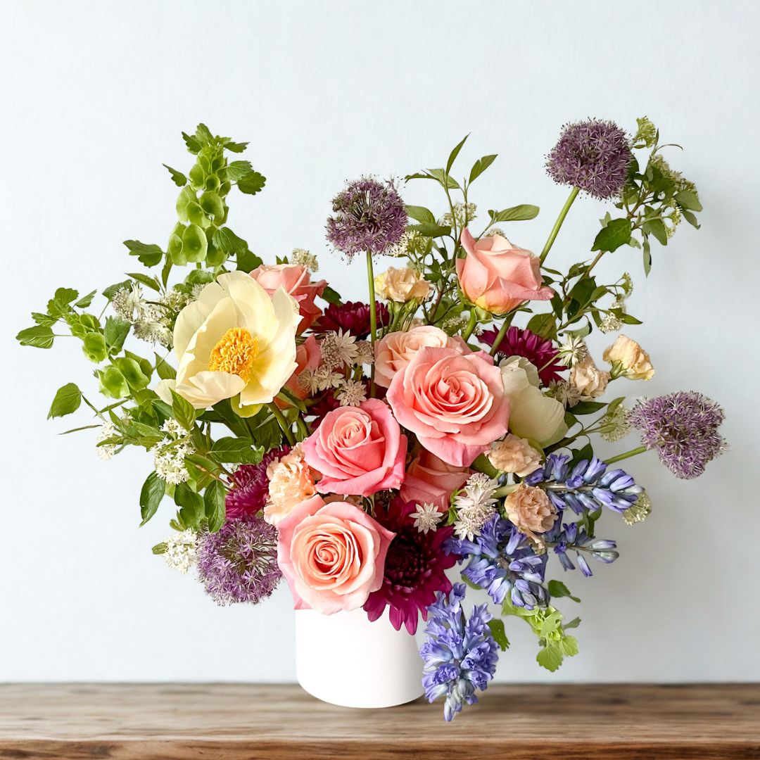 Premium sympathy floral arrangement with vibrant seasonal blooms in a keepsake ceramic vase, refined garden-style design delivered to Edina, Golden Valley, and Excelsior
