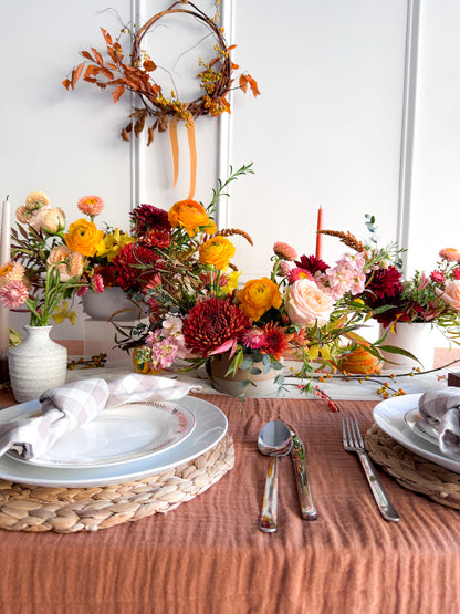 Premium Thanksgiving arrangement with abundant seasonal blooms in shades of orange, peach, burgundy, and gold, lush garden-style design in keepsake vase, from a local, small-business, women-owned flower shop
