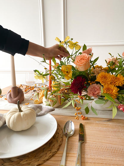 Luxury Deluxe Thanksgiving floral arrangement featuring lush autumn blooms in shades of orange, burgundy, and gold, garden-inspired design, pick-up in Edina or local delivery
