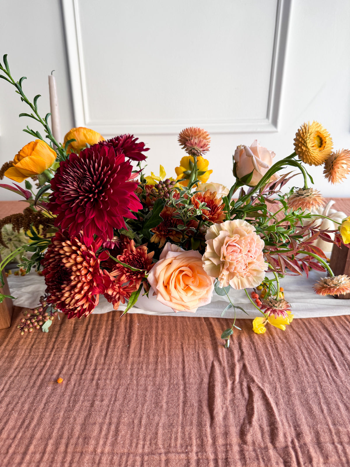 Elegant rectangular Low & Luxe Thanksgiving arrangement with abundant seasonal blooms and organic greenery, sophisticated floral centerpiece for holidays, available for Edina pick-up or Minneapolis delivery