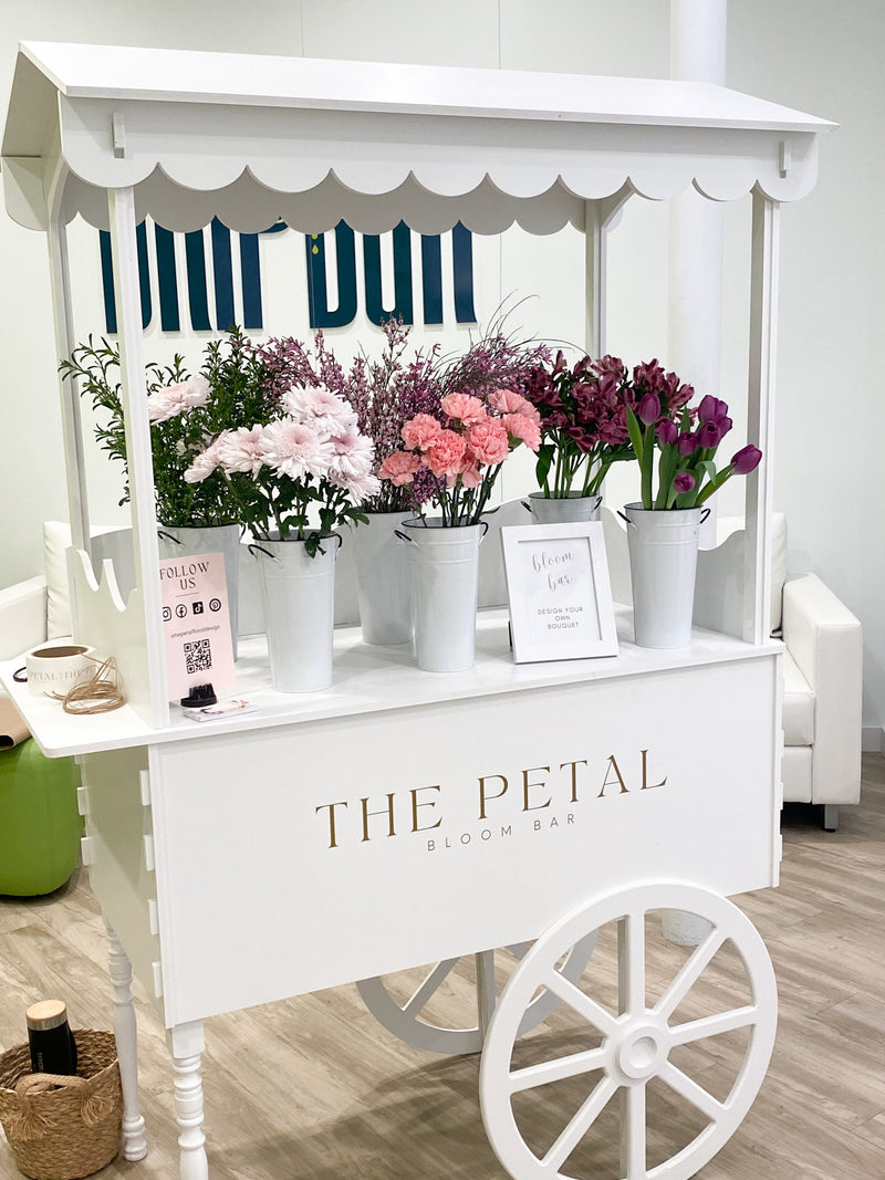 Bloom bar experience for rent for upcoming baby, bridal shower, graduation party, corporate event or birthday party. Guests build a bouquet.