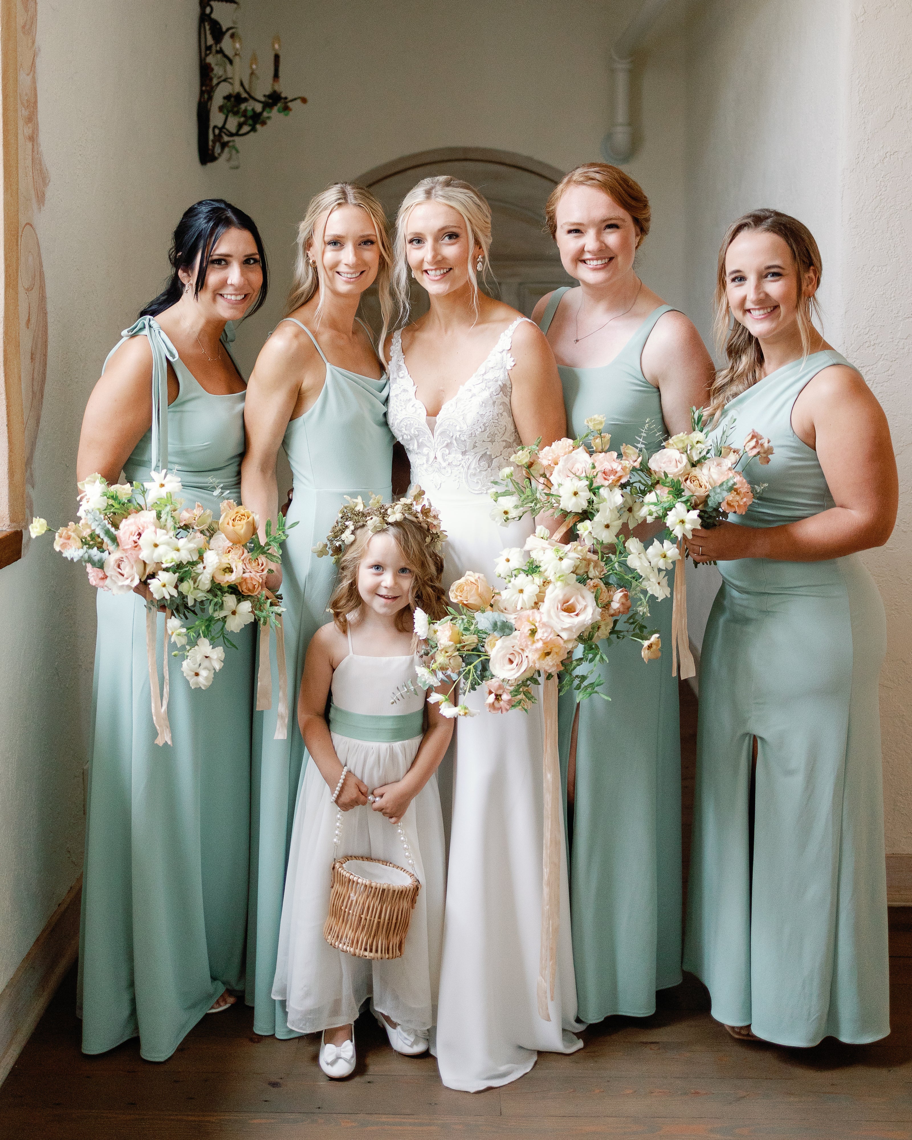 soft peach bouquets for bridal party in sage green dresses at bavaria downs minnesota