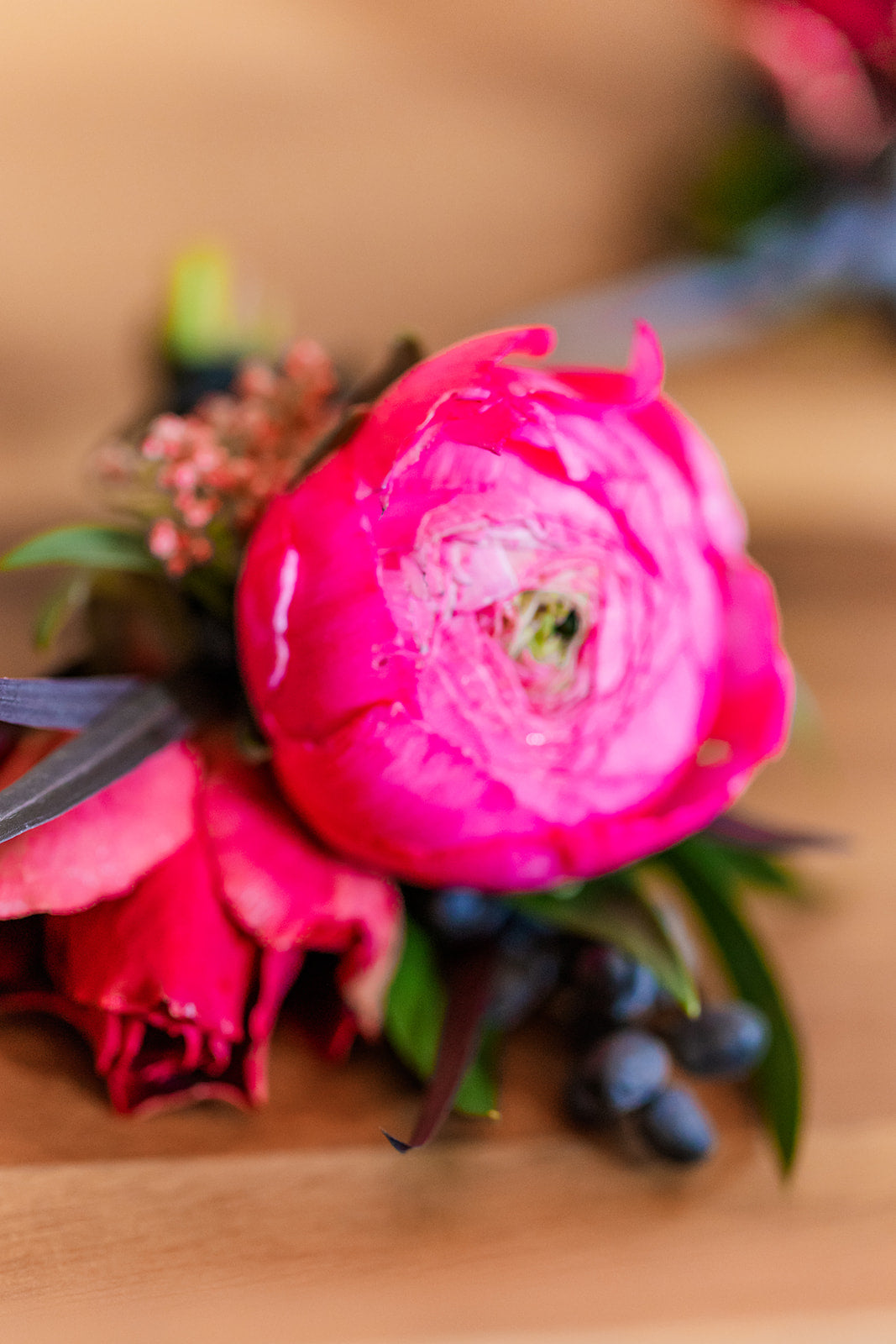 A colorful wrist corsage attached with a pink ribbon. Prom, homecoming, wedding custom corsage