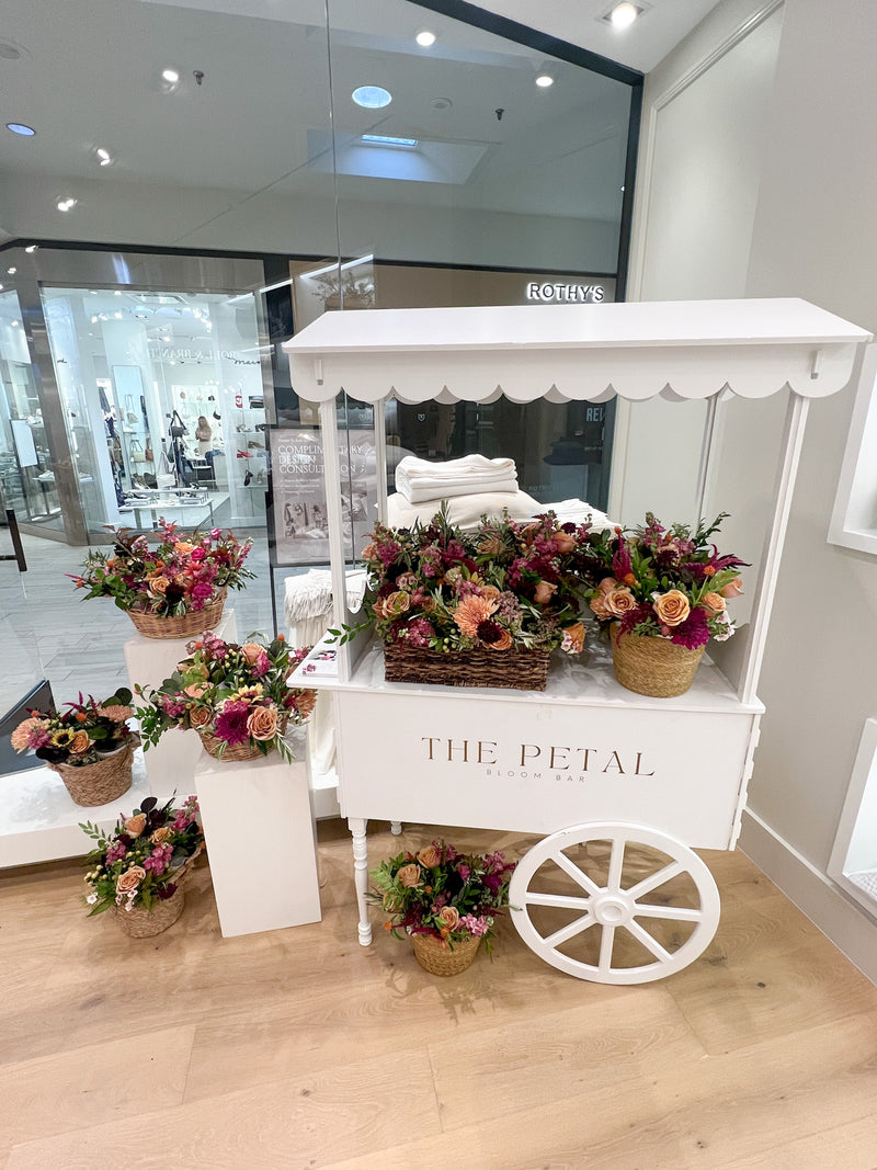 The Petal Bloom Bar flower cart filled with seasonal flowers for a Corporate event customer appreciation brand event in Edina.