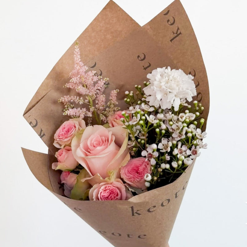 Custom branded bouquet of flowers for Bloom Bar flower cart build a bouquet event for a brand launch, product launch, corporate event in MInneapolis.