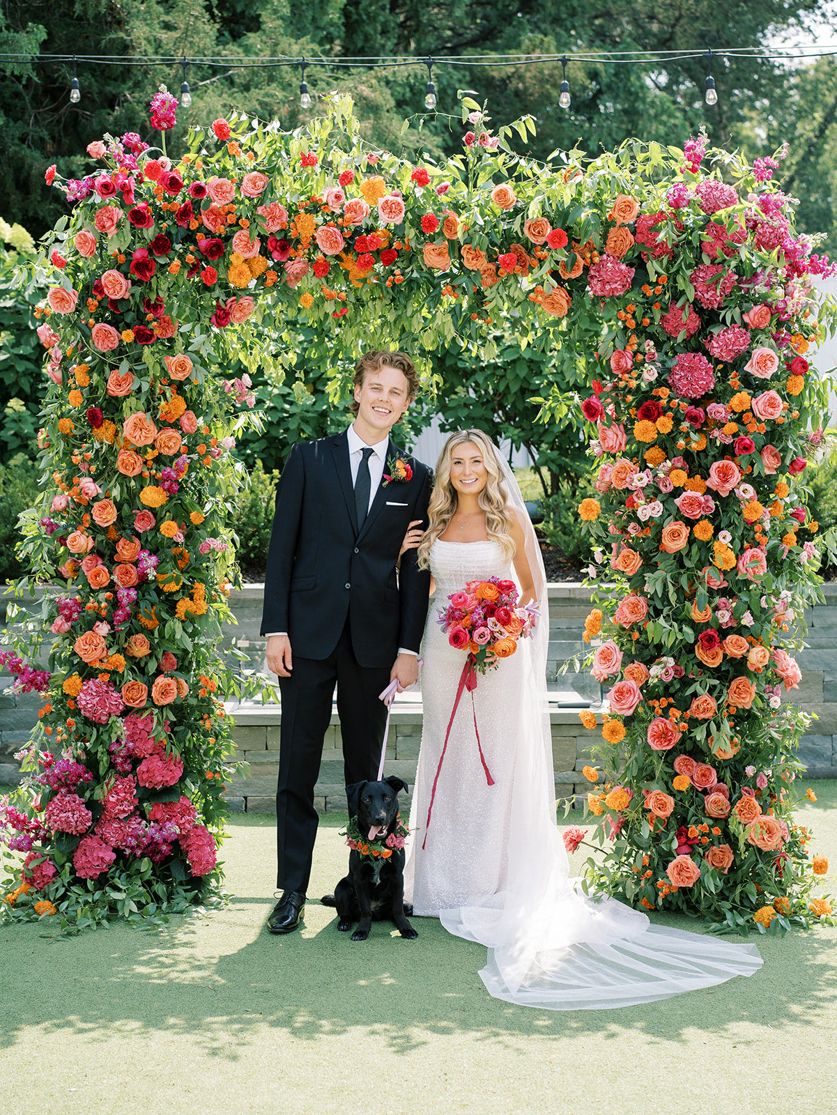 Lush colorful summer floral arch for ceremony for luxury weddings in MInnesota