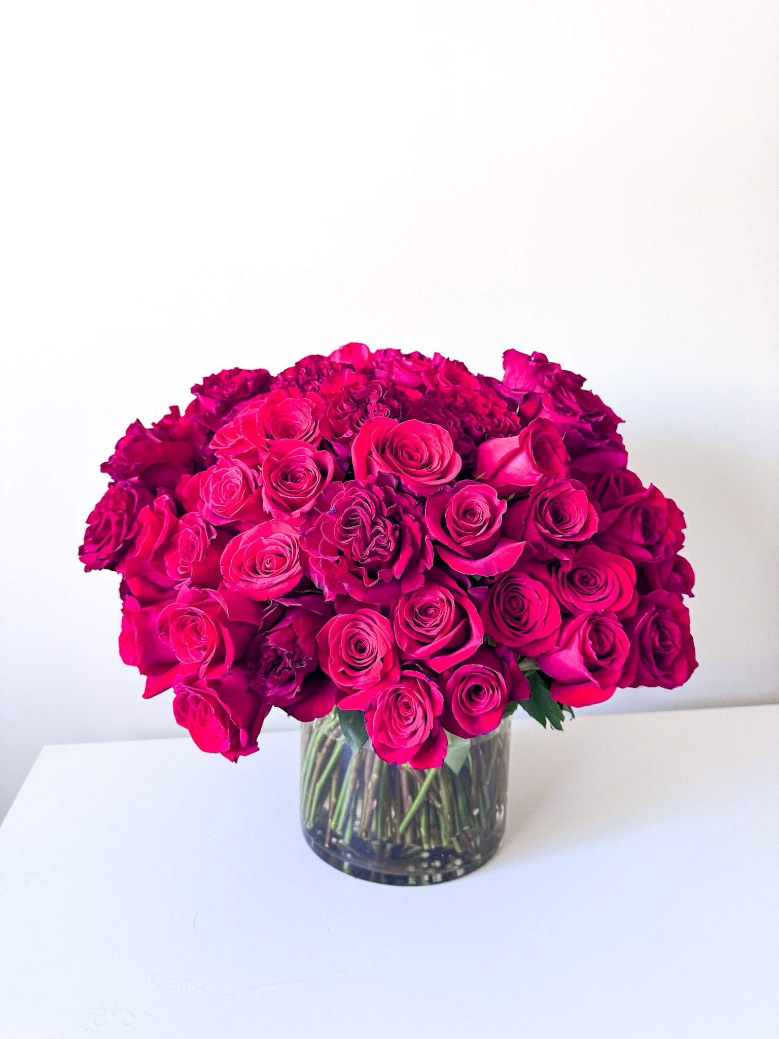 Romantic arrangement of 100 stems of red roses for your love. The perfect gift for her for an anniversary, birthday or just because from the best florist in minneapolis. Order for delivery to wayzata, minneapolis, edina, and savage.