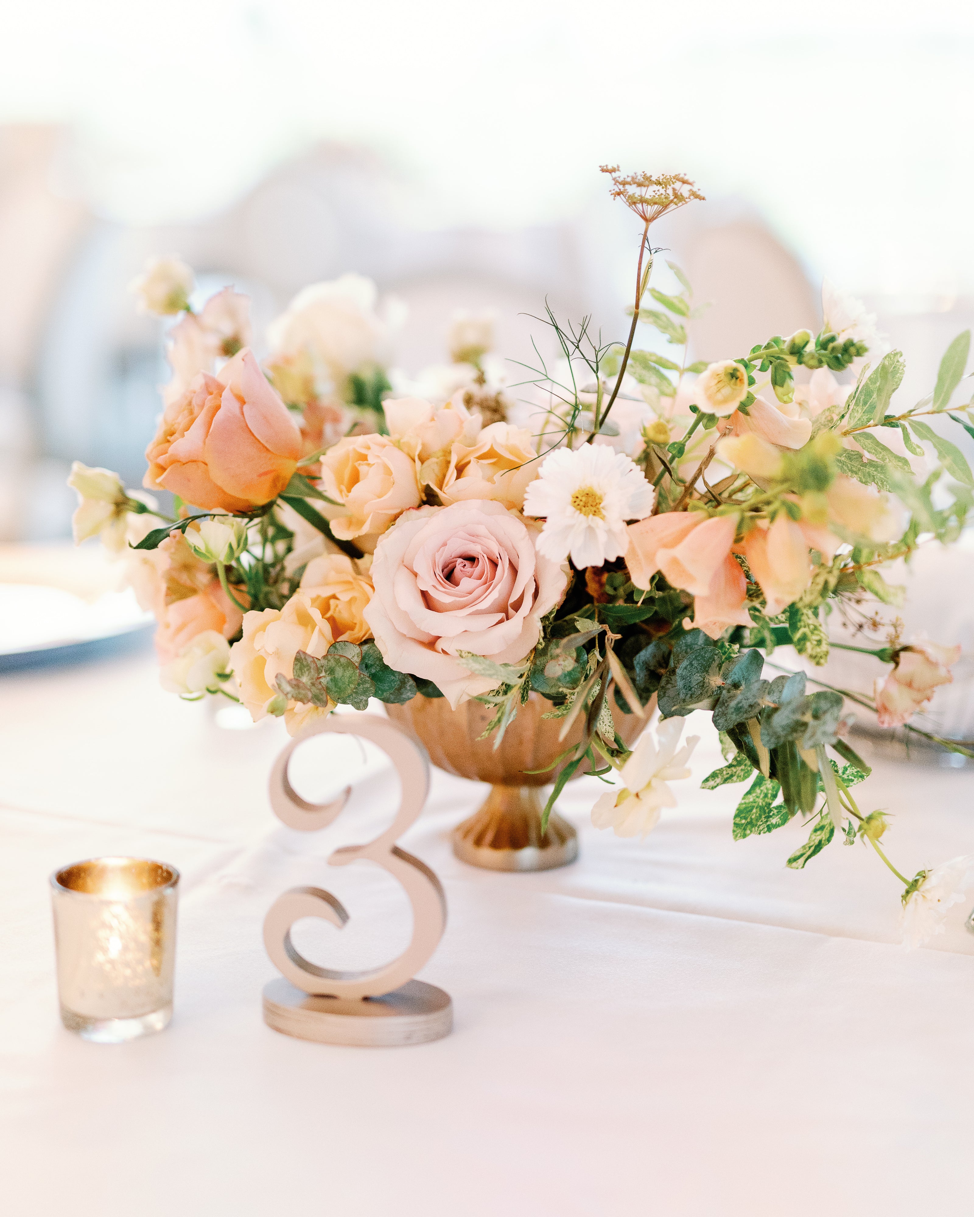Romantic compote arrangement of peach flowers for wedding reception at Bavaria Downs in Minneapolis by top wedding florist The Petal