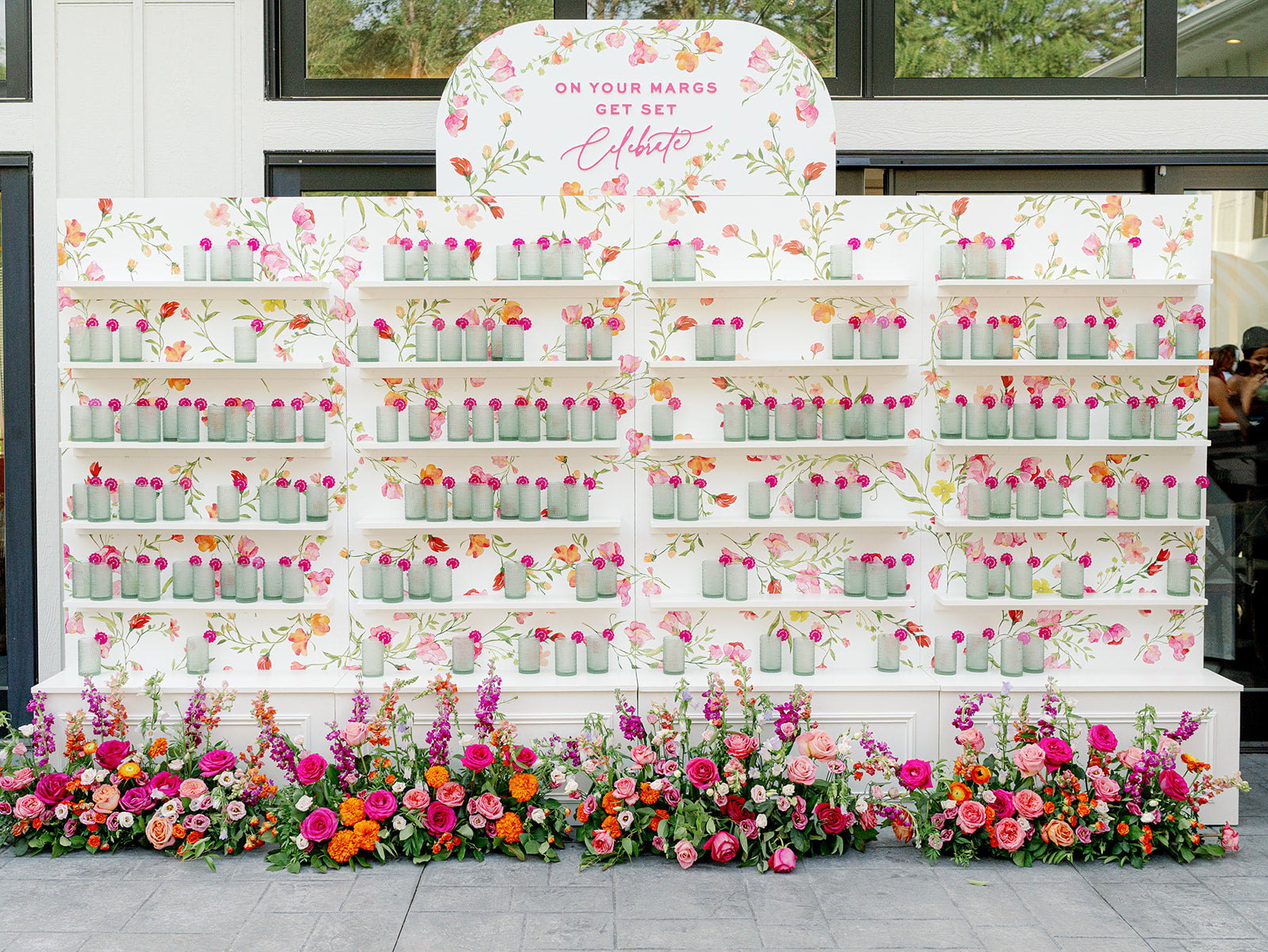Custom seating chart wall with margaritas and florals. colorful summer garden wedding. Girl Friday design