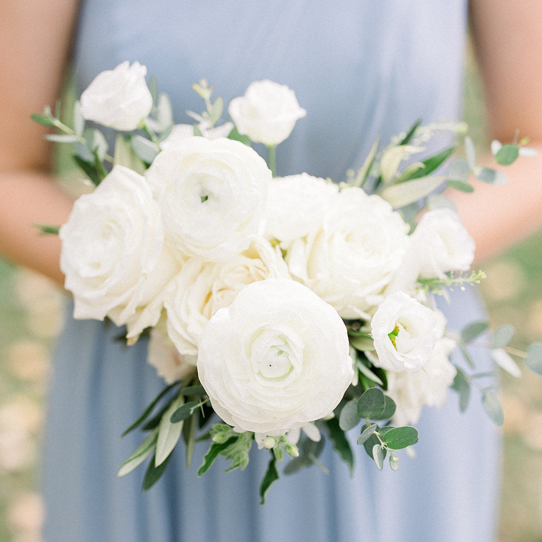 Small bouquet of white flowers including roses and ranunculus for an intimate wedding in Minneapolis from top florist, The Petal.