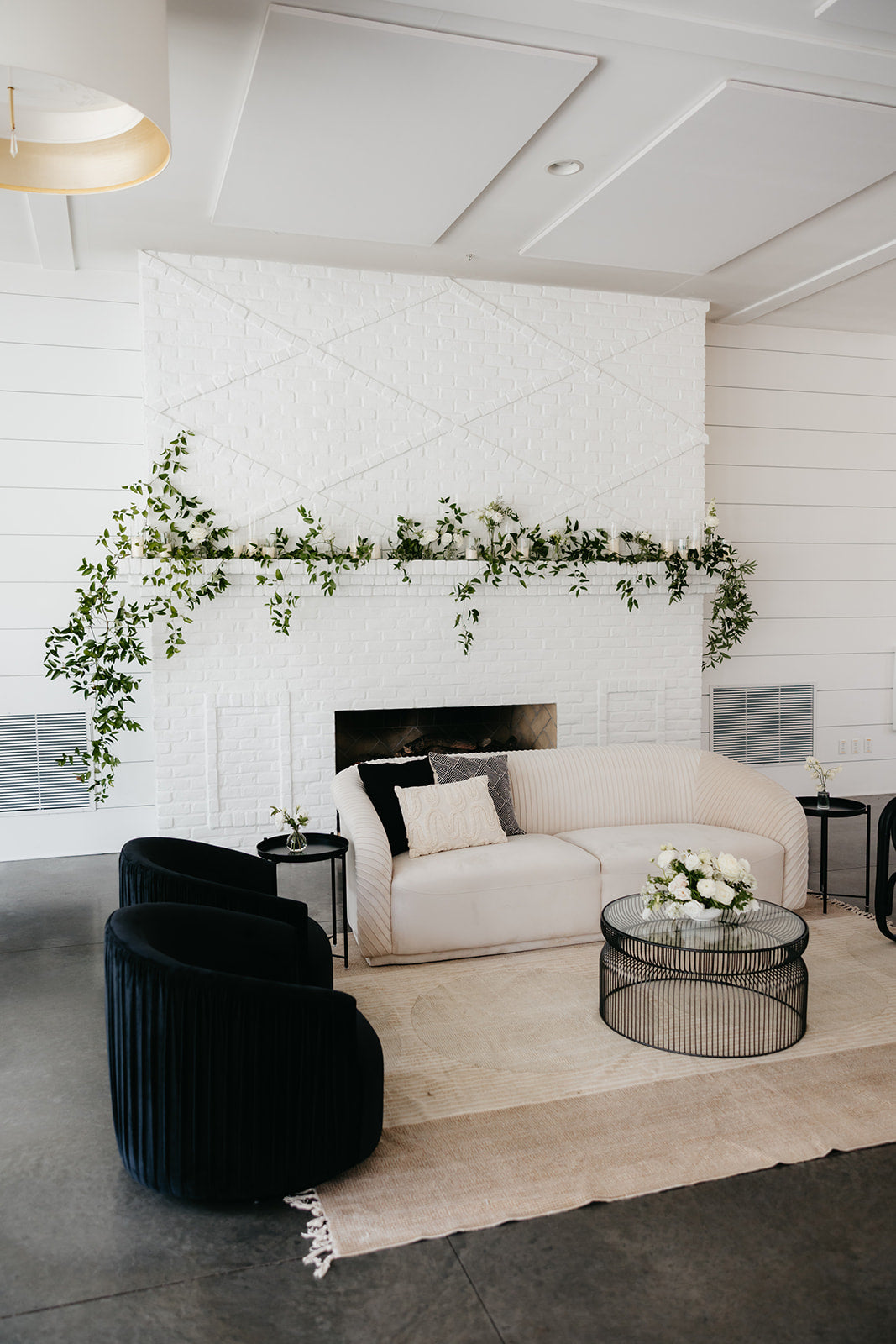 Greenery on Hutton House fireplace accented with candles