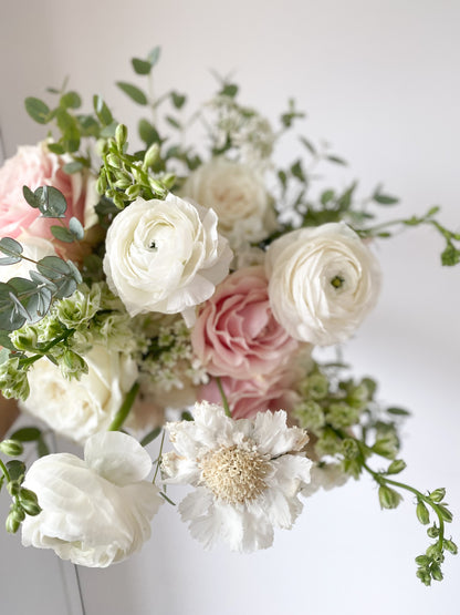 Soft, neutral bridal bouquet with blush pink and white flowers hand-tied for your wedding day in Minneapolis.