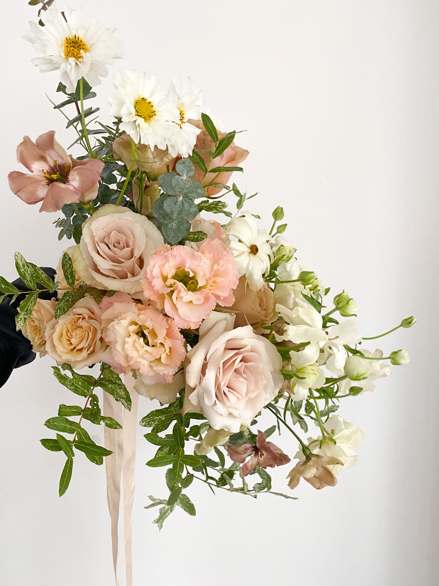 A whimsical bridal bouquet of soft neutrals and peaches for an a la carte wedding in Minneapolis. Shop our collection.