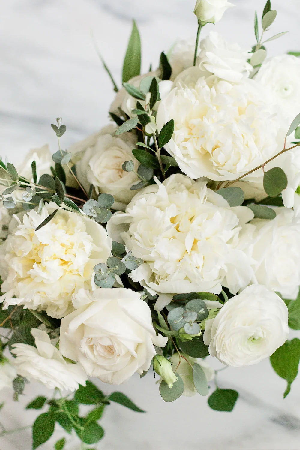 white-peony-and-eucalyptus-bridal-bouquet.webp__PID:68ae85c1-218f-4f08-9ccf-cf87cc474f41